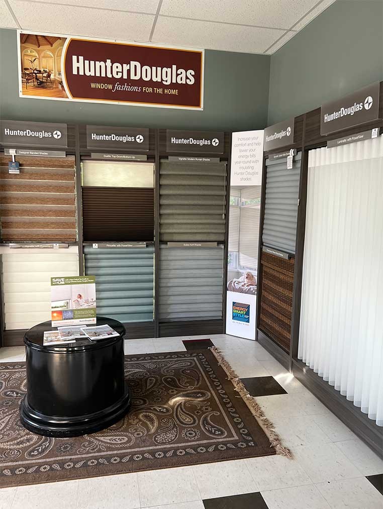 A display of multiple Hunter Douglas window coverings